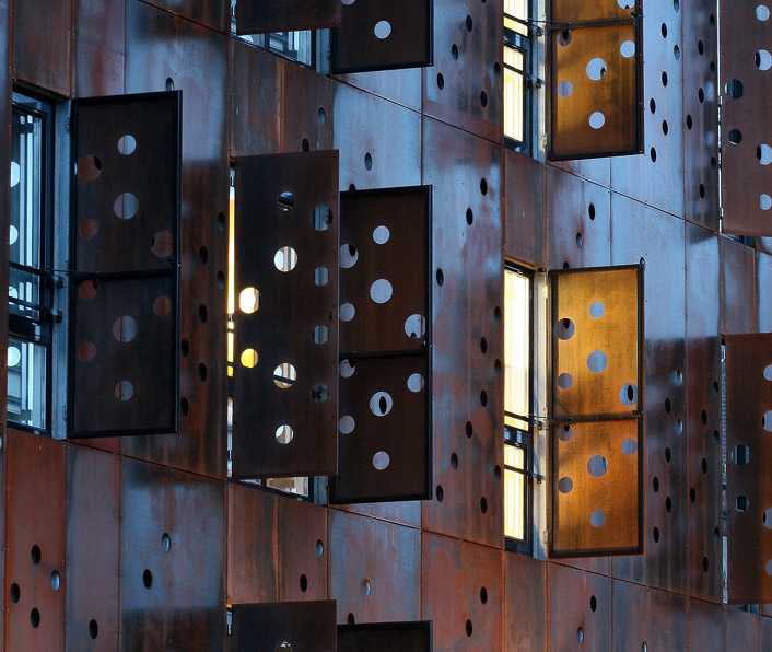 Perforated rustred steel panels covering whole façade [491] filt3rs